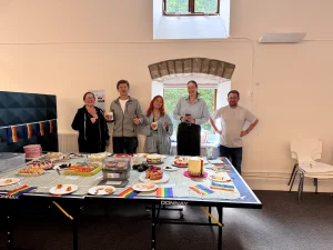 Members of the BSR team stood next to a table of home made baked goods