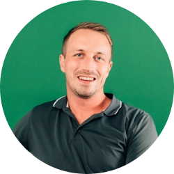 Portrait of man with short hair against green background